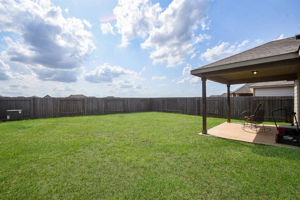 Fully Fenced Large Backyard with NO BACKYARD NEIGHBORS! Approx. 14x10 Covered Back Patio.