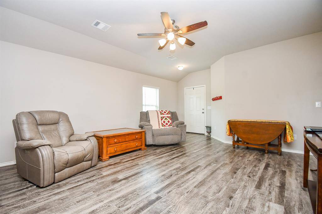 High Ceilings. Large Living Area. Vinyl Wood Plank Floors.
