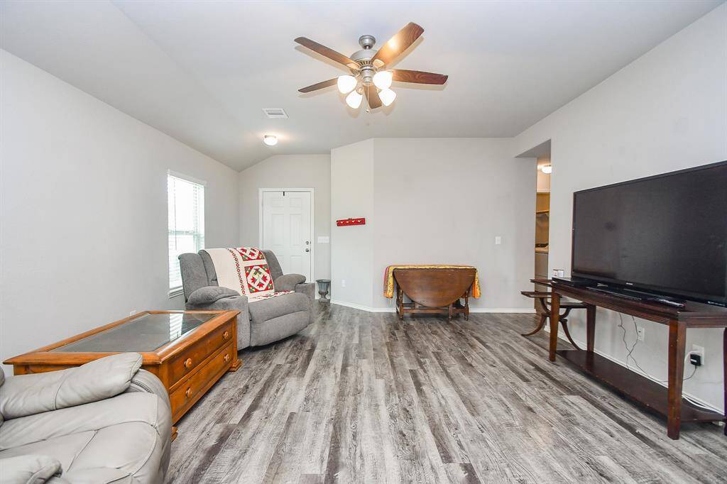 High Ceilings. Large Living Area. Vinyl Wood Plank Floors.