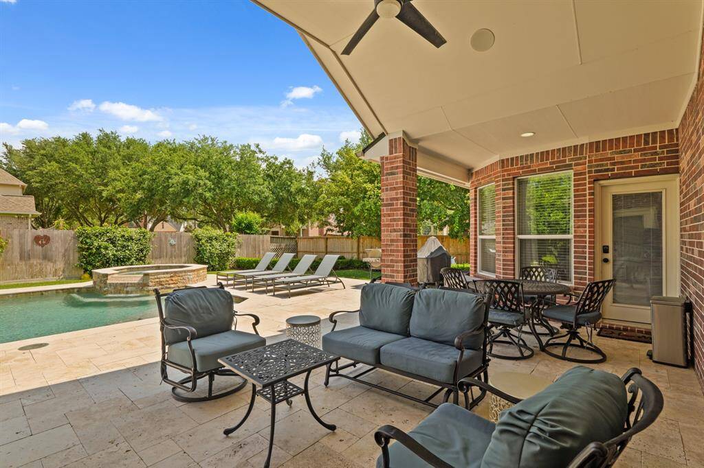 Kick back and relax on the covered backyard patio.