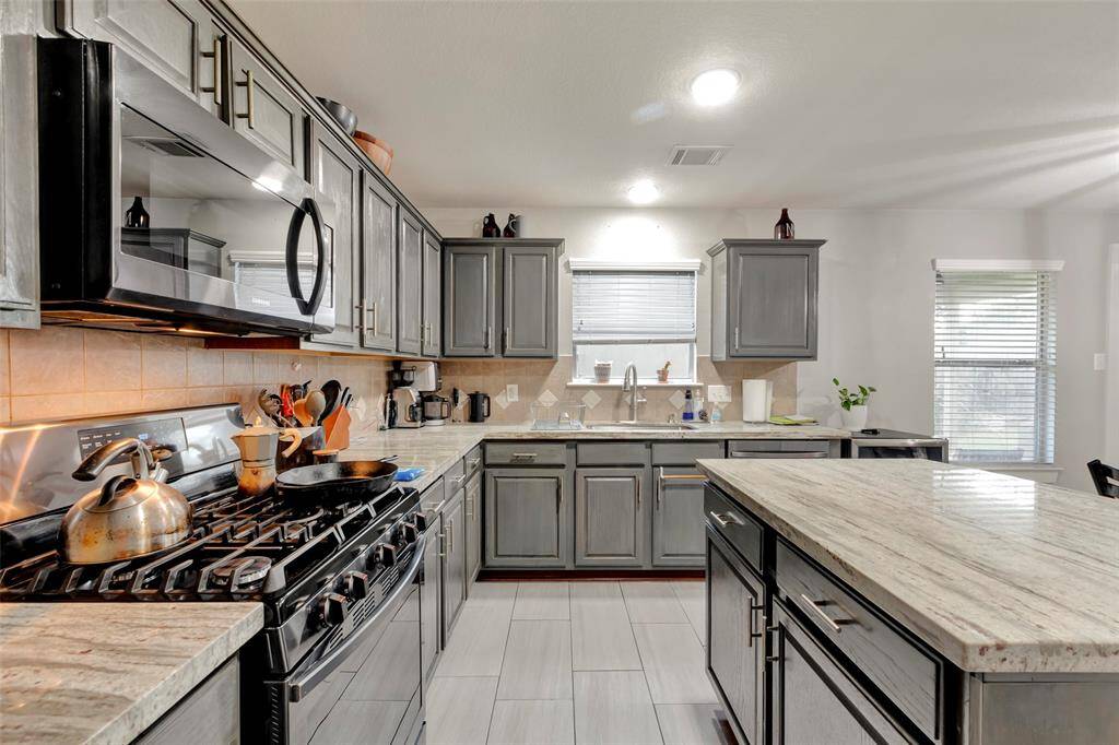 A closer look of the built-in microwave and gas range.