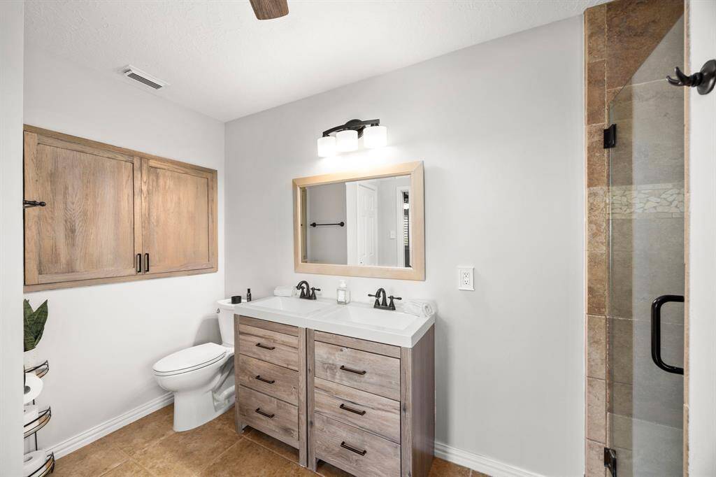 The primary bathroom features an over-sized medicine cabinet (over the toilet) and not pictured is a large linen closet for amazing storage!