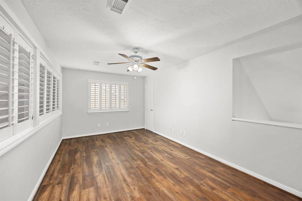 Flex room/loft area as you enter the upstairs has so many uses anf the door pictured leads to a large attic storage closet!