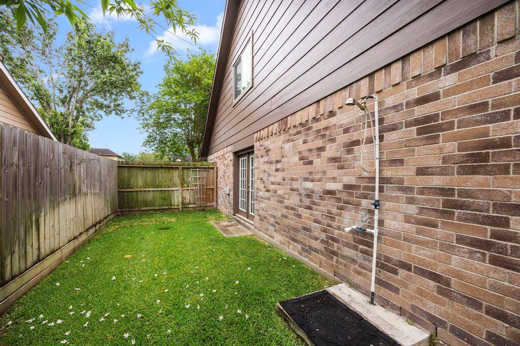 An Added outdoor shower head for rinsing off after pool time.
