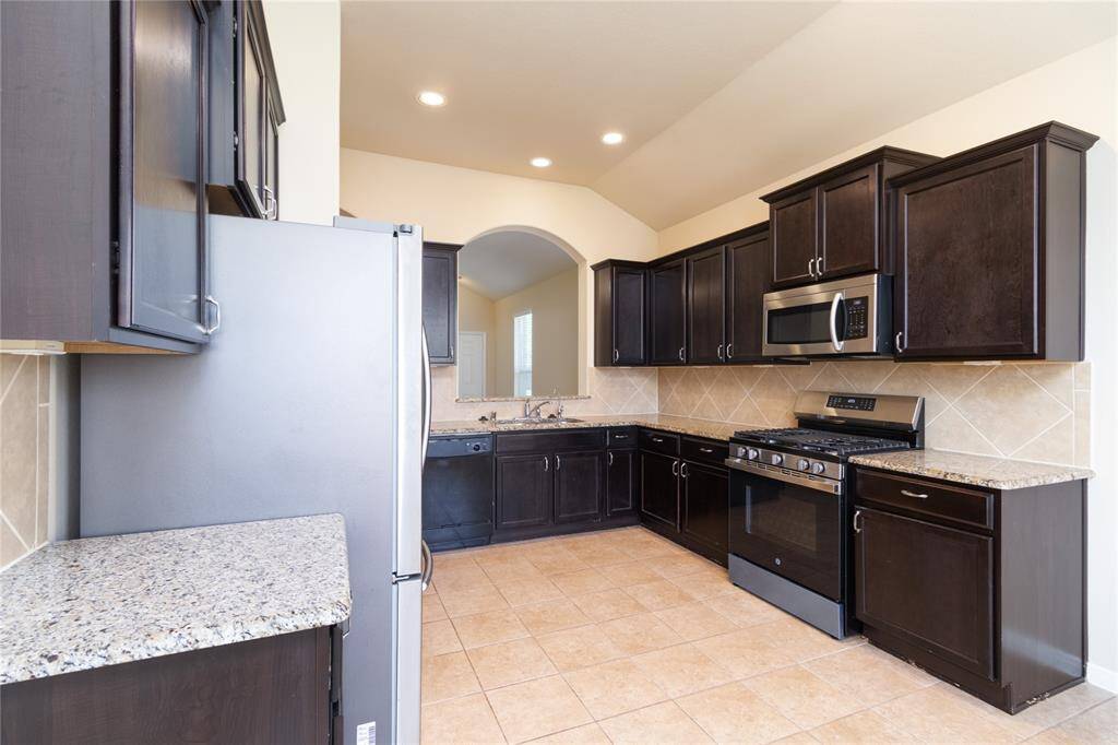 Kitchen Offers a Stand Alone Gas Range/Oven and Granite Countertops