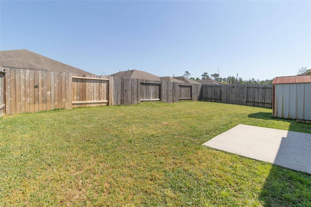 Home has a Back Patio and Fenced In Backyard