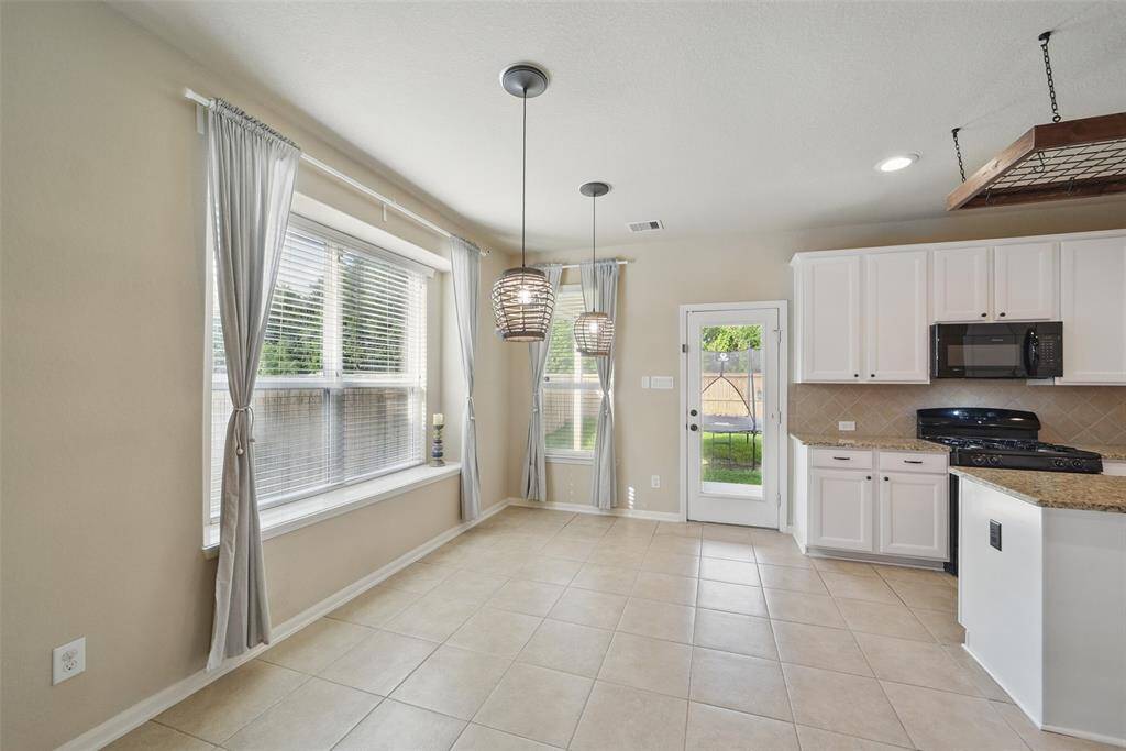 Plenty of space for a large table and chairs.  Notice the seating on the window sill.