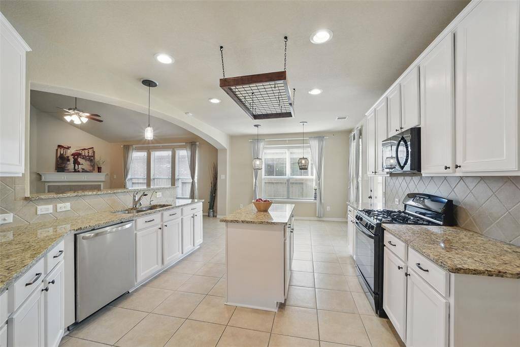 The pots & pans rack will make cooking convenient.  The island provides additional storage and counter space.