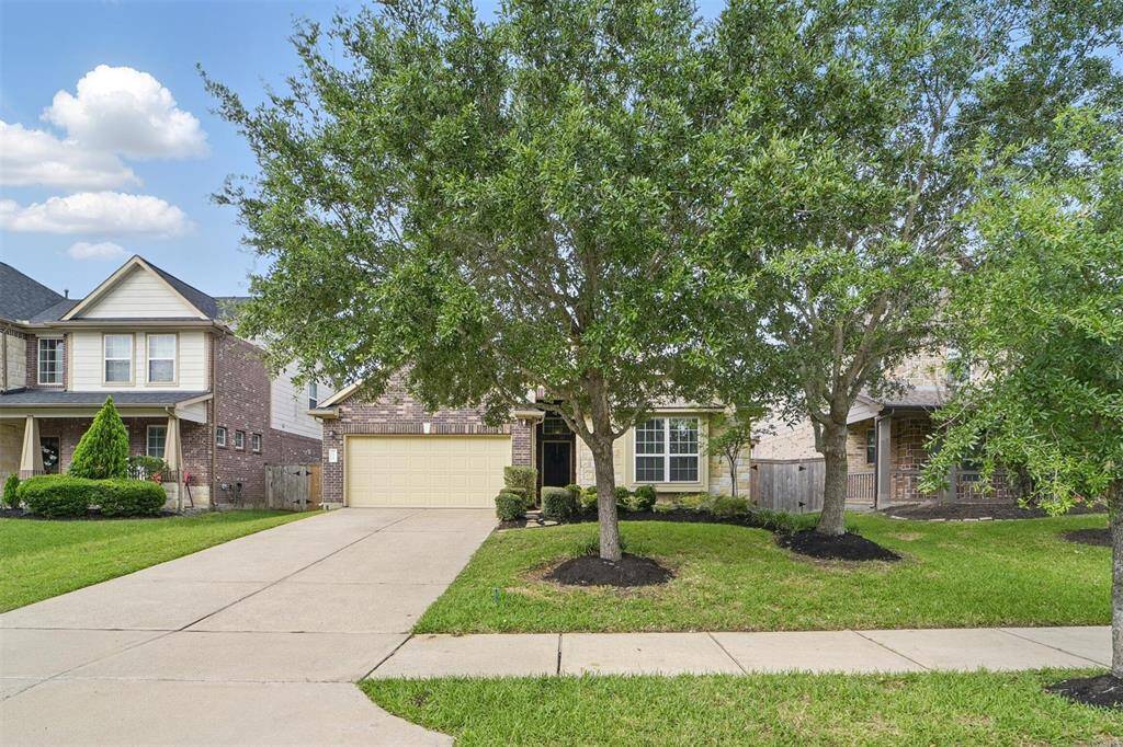 Mature trees and lush landscaping.