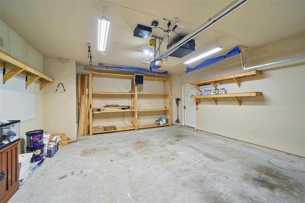 Look at all the storage shelving in this garage!!