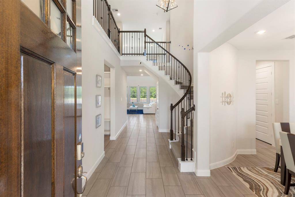 Filled with natural light, the entry welcomes all to light, bright, neutral palette.