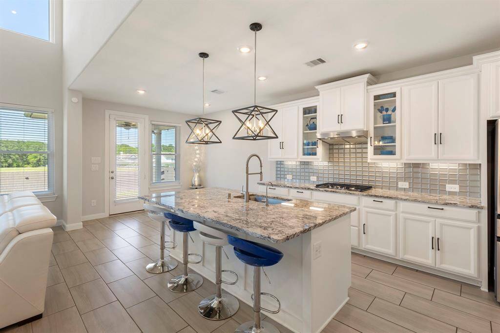 Custom light fixtures and plenty of cabinetry.