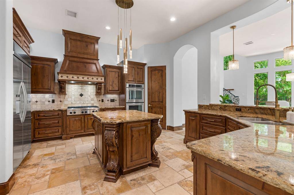 Both beautiful and functional, it also features high-end appliances and ample counter space.