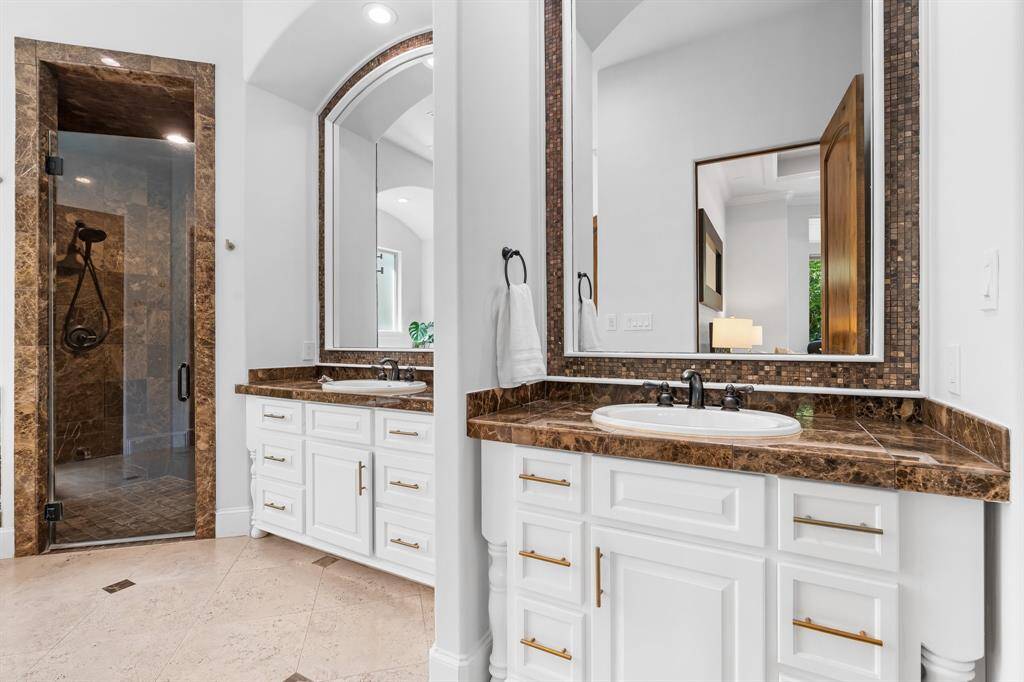 His and her vanities have been updated with recent paint and new hardware.