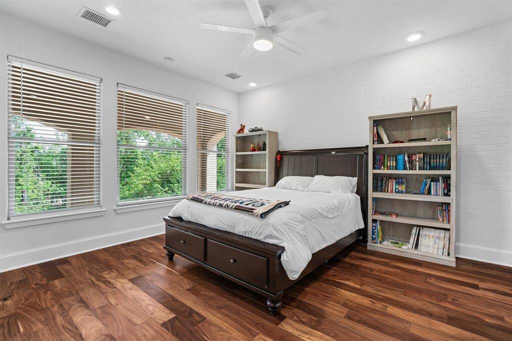 There are two additional bedrooms on the second floor updated with fresh paint, new flooring and lighted ceiling fans.