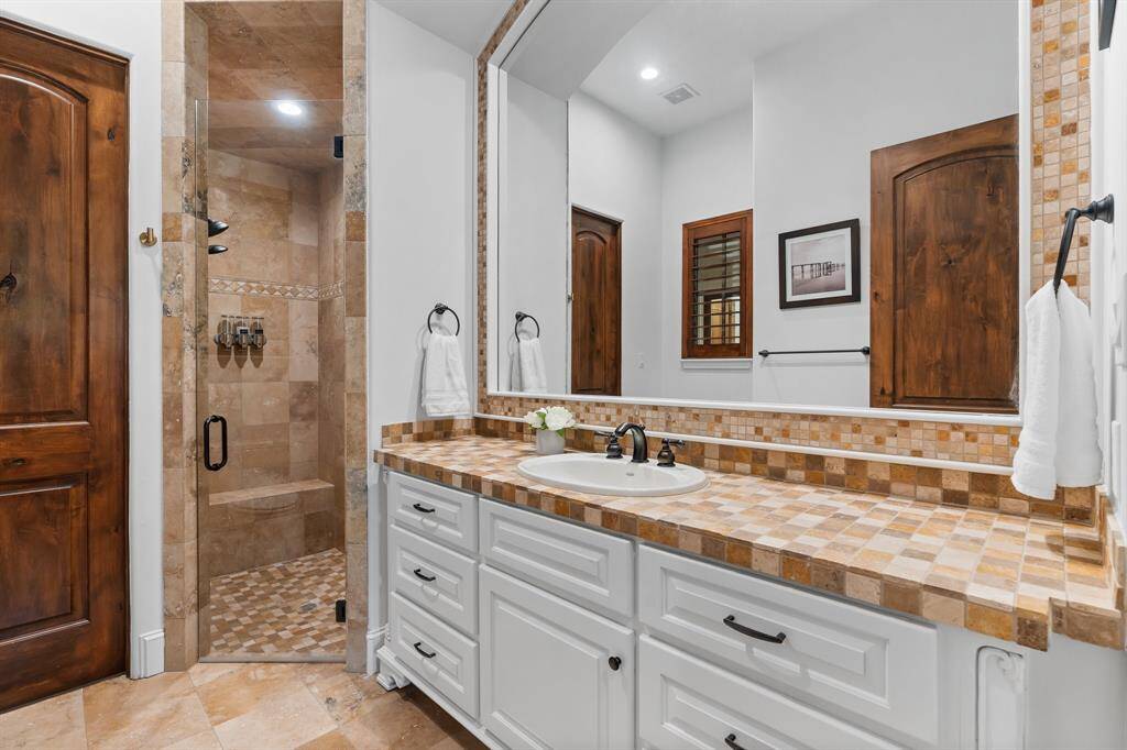 The adjoining bath has every amenity including a walk-in shower and generous closet.