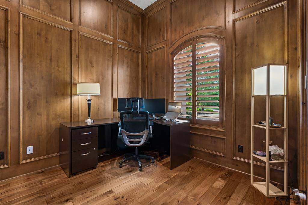 There’s ample space for additional seating, while plantation shutters allow natural light to fill the room.