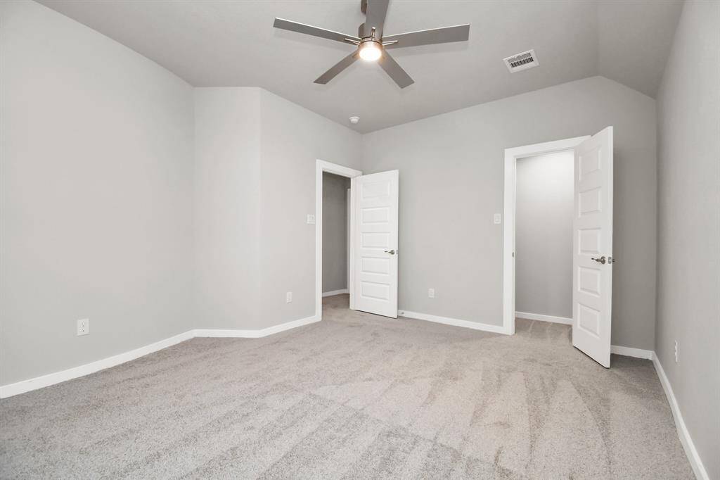 Generously sized secondary bedrooms featuring spacious closets, soft and inviting carpetingunderfoot, large windows allowing plenty of natural light, and the added touch of privacyblinds for your personal retreat. Sample photo of completed home with similar floor plan. Actual colors and selections may vary.