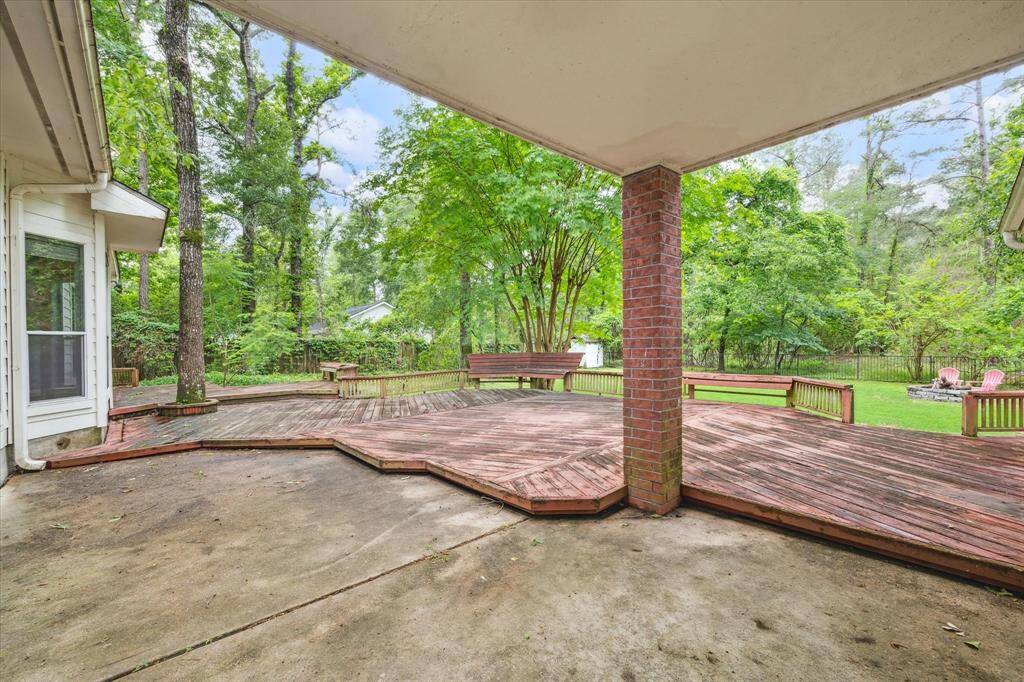 Welcome to your backyard oasis, complete with an expansive deck and tranquil views of the surrounding natural landscape.