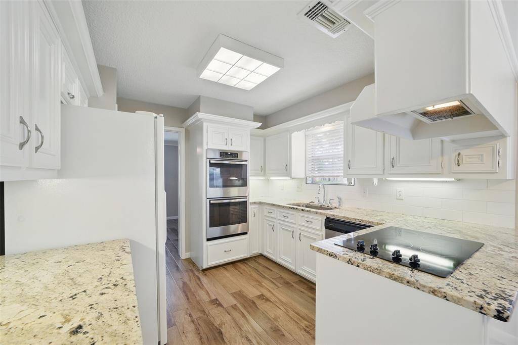 The kitchen offers lots of light and the fridge is included.