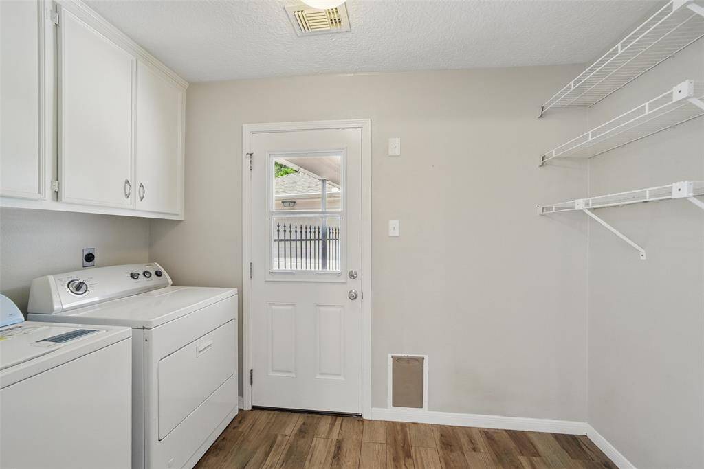 Washer & Dryer are included in this spacious laundry room with access to the back yard and detached garage.