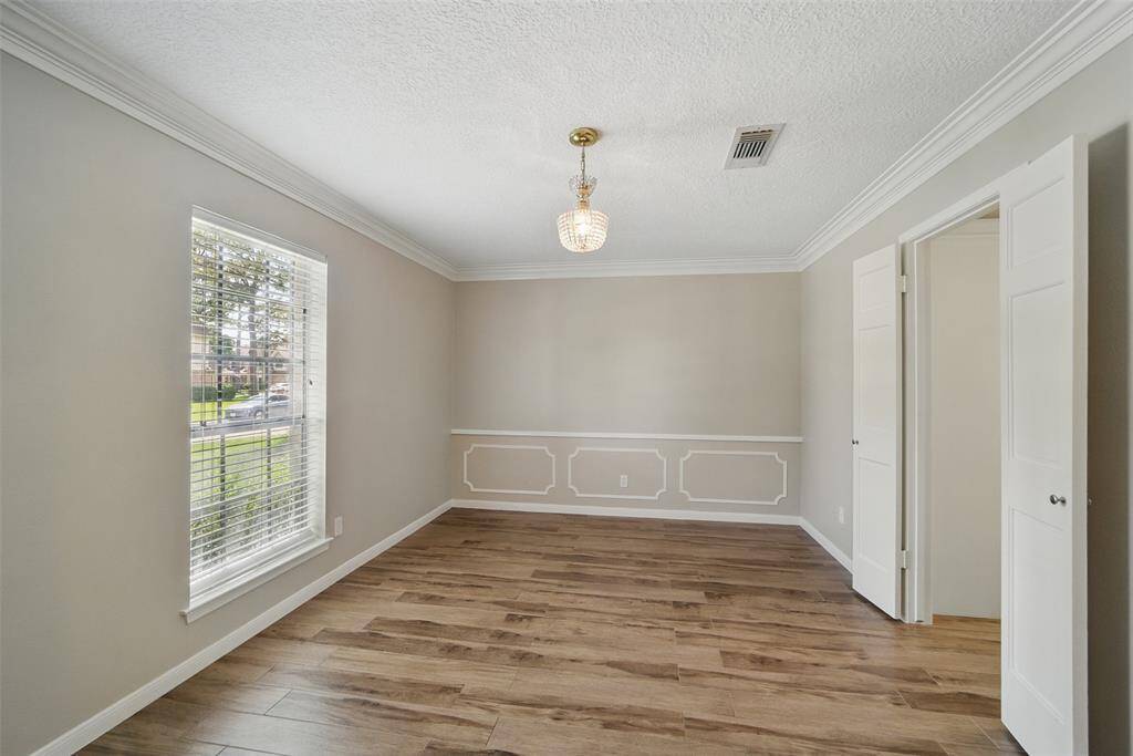 The formal dining is roomy with french door access to the kitchen. This flex space could also be used as a formal living area or Office.
