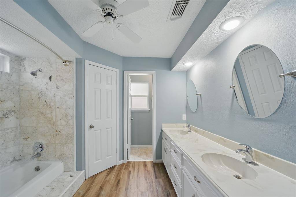 Primary bath has 2 walk-in closets, both lined with cedar wood.