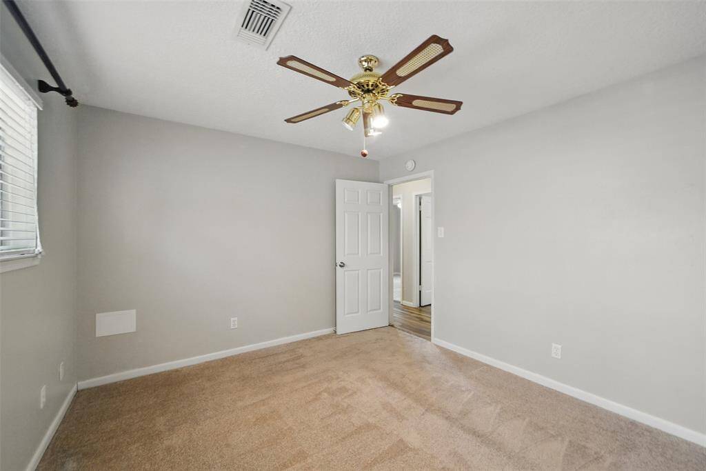 Secondary bedrooms all have plush carpet and ceiling fans.