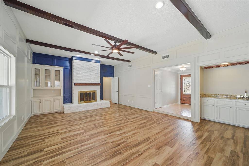 The high ceilings are adorned with wood beams.