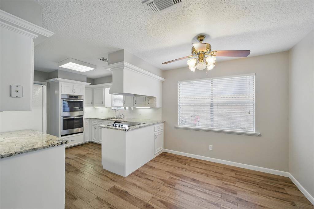 Your breakfast nook is bright and overlooks the living area.
