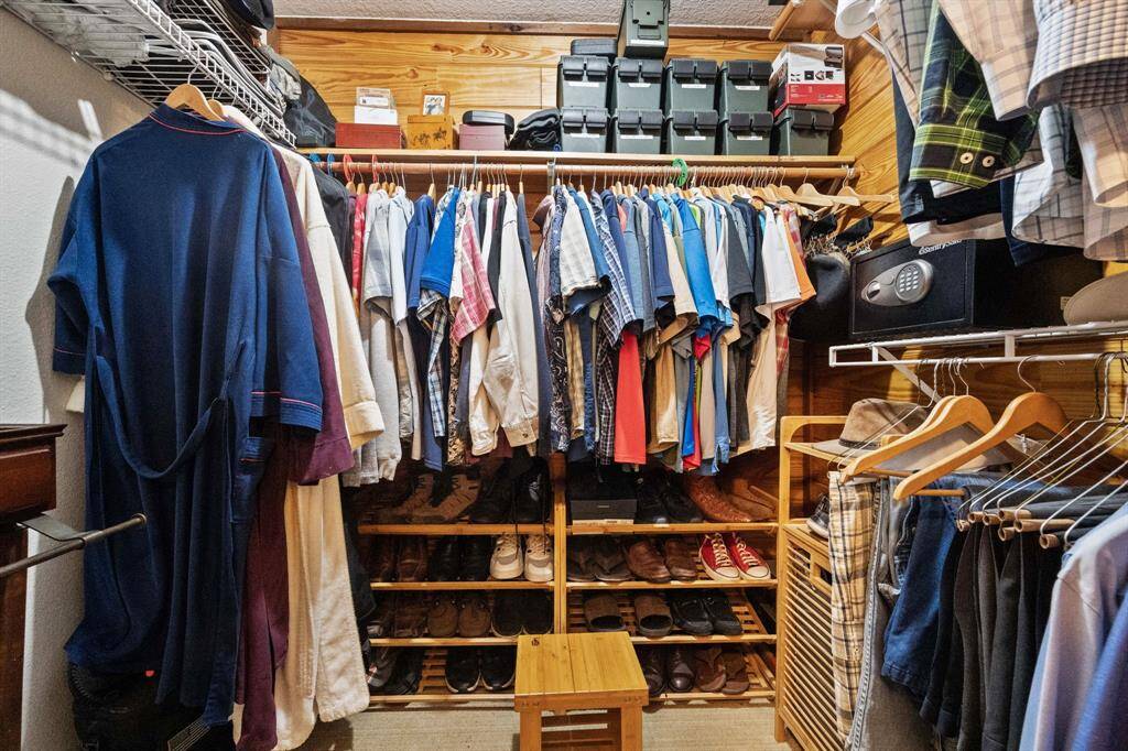 Primary bedroom features separate closet spaces