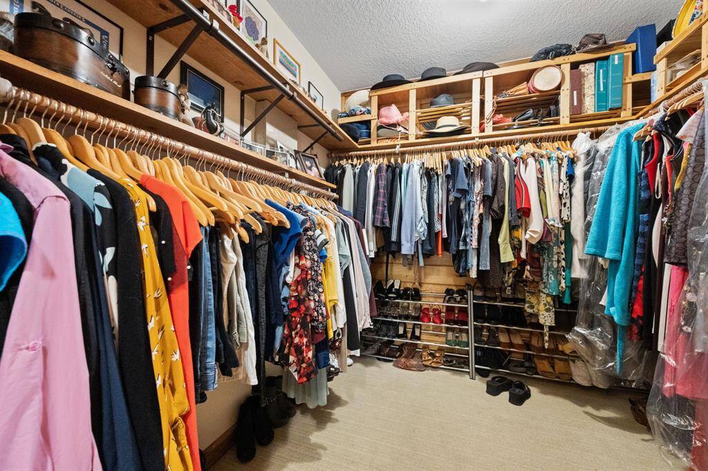 Primary bedroom features separate closet spaces