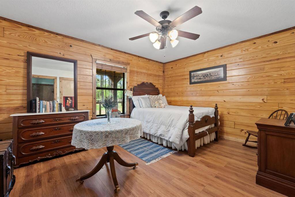 Cozy secondary bedroom with picturesque view of property.