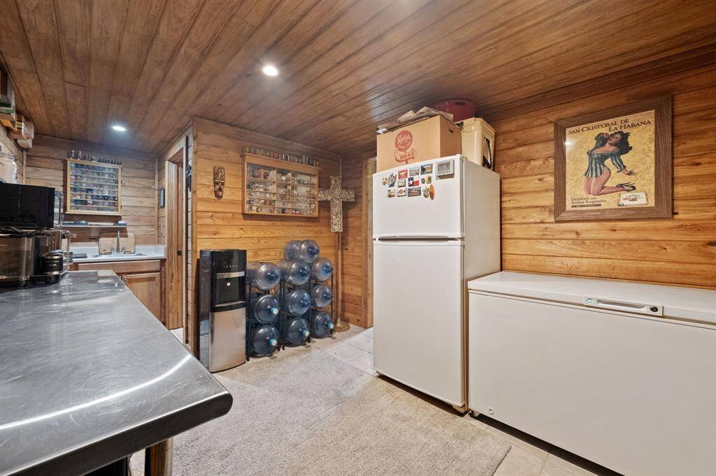 Just off the room you will enter into a kitchenette. Plenty of space for a freezer, fridge, two stainless steel prep tables.