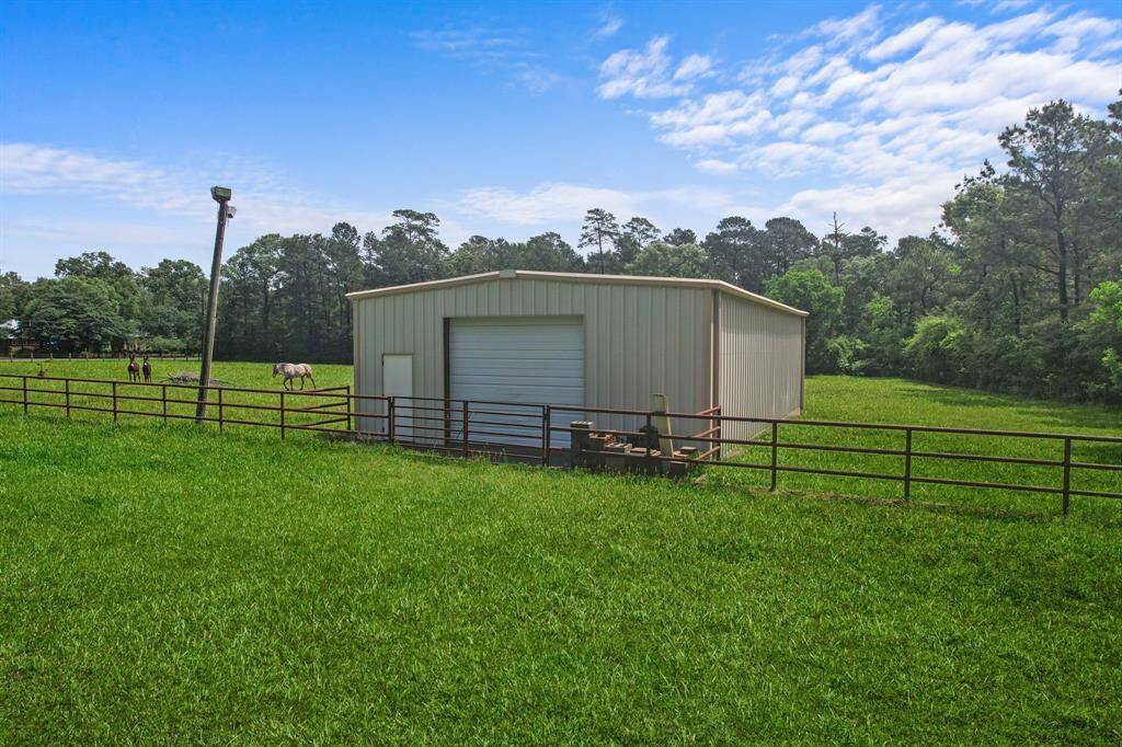This spacious metal barn is perfect for storage.