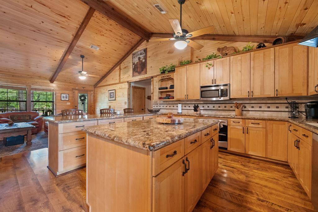 Entry way into the large kitchen with ample counter space and large island.