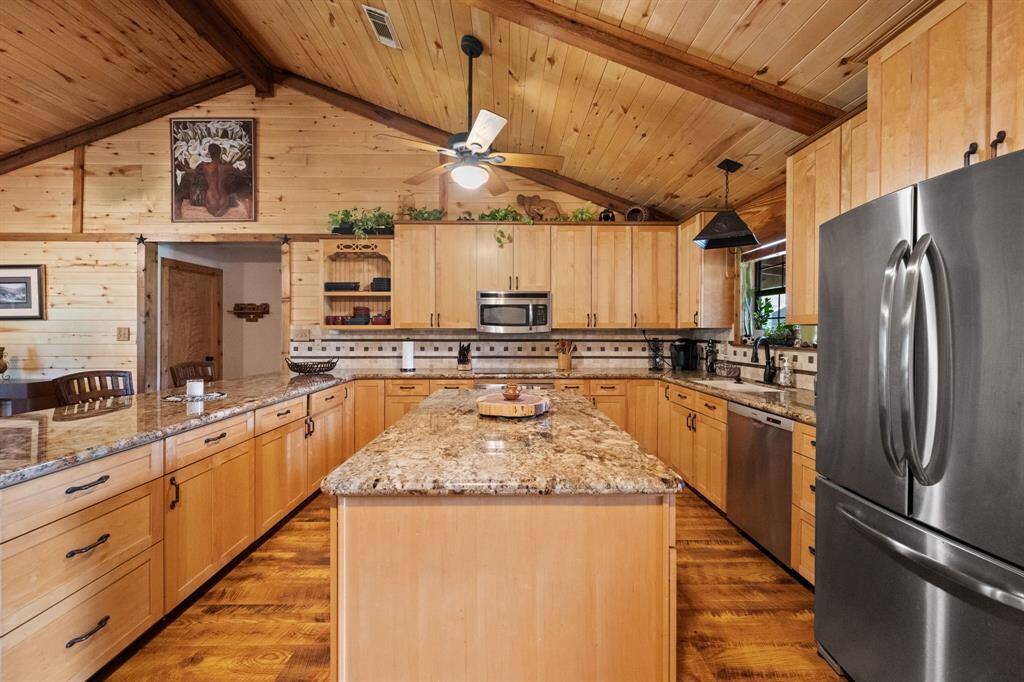 Plenty of storage space in cabinets. Open living area is perfect for entertaining.