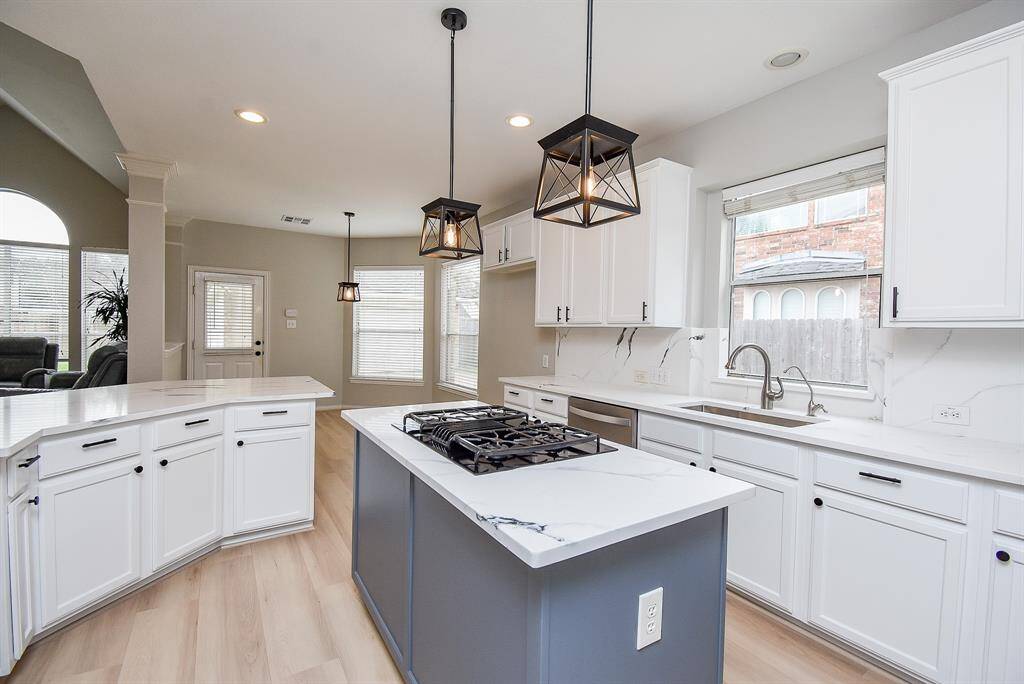The space is bright and open, with large windows allowing natural light to fill the room.
