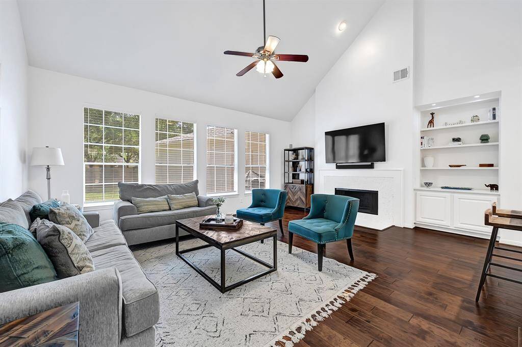 Spacious living room with abundant natural light and open flow