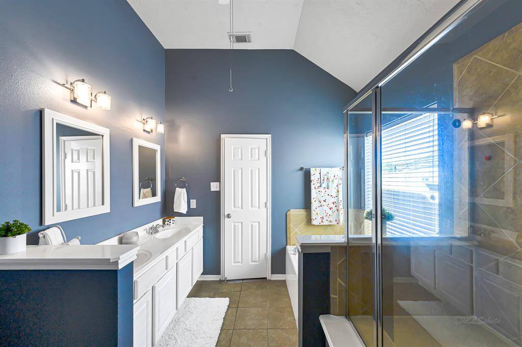 Primary bathroom will be repainted a neutral color before tenant move-in.