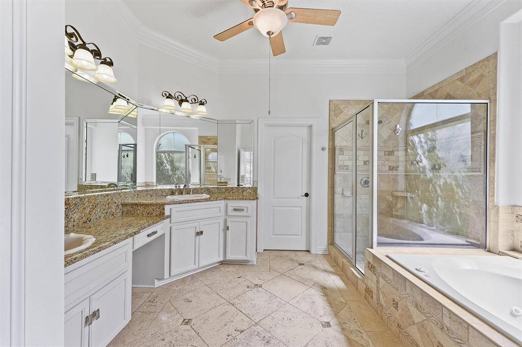 Primary bathroom with separate walk in shower and tub