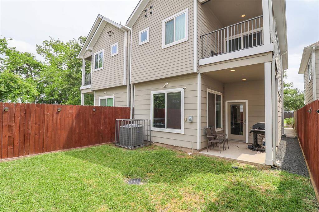 Fully fenced backyard with patio space.