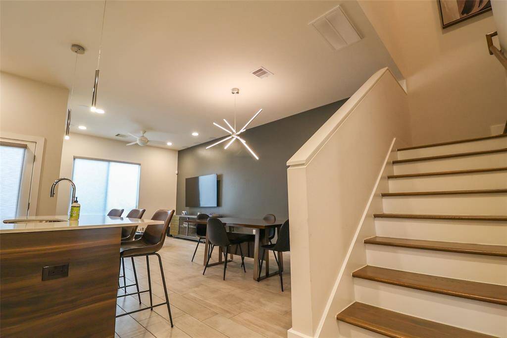 Stairway to second floor at the front door access.