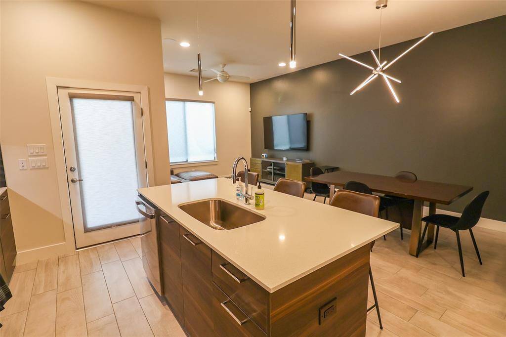 Spacious island with farm house sink. Island comfortable seats 3 people.