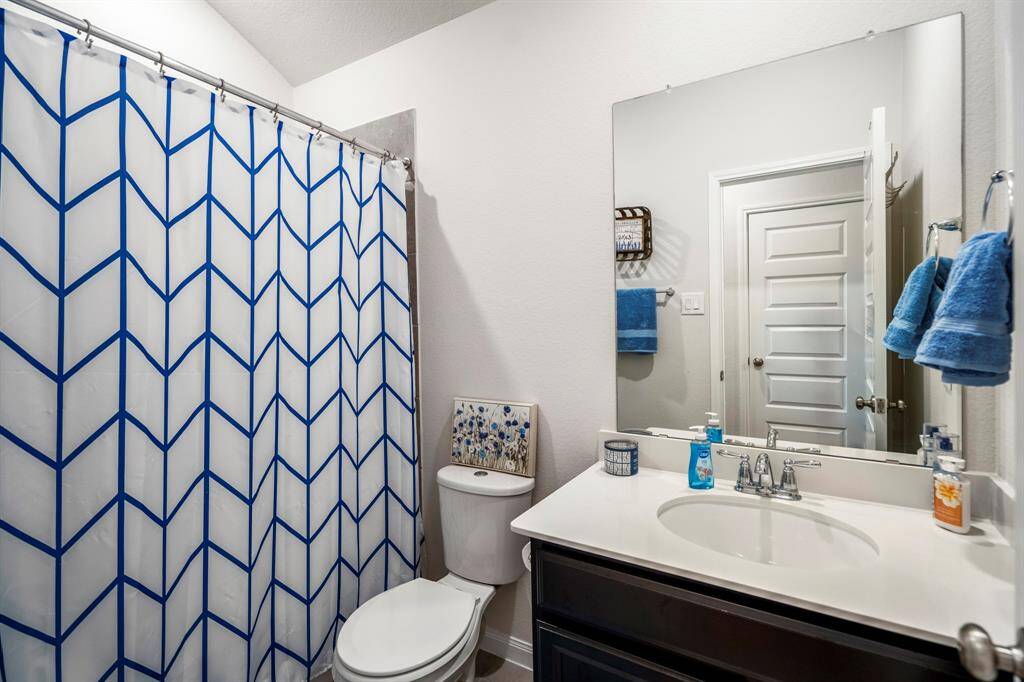 The second full bathroom is located between bedroom 2 and 3.