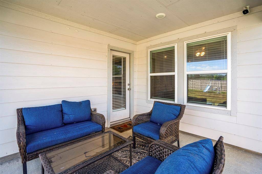 Enjoy spending time on your covered patio, overlooking your oversized lot.