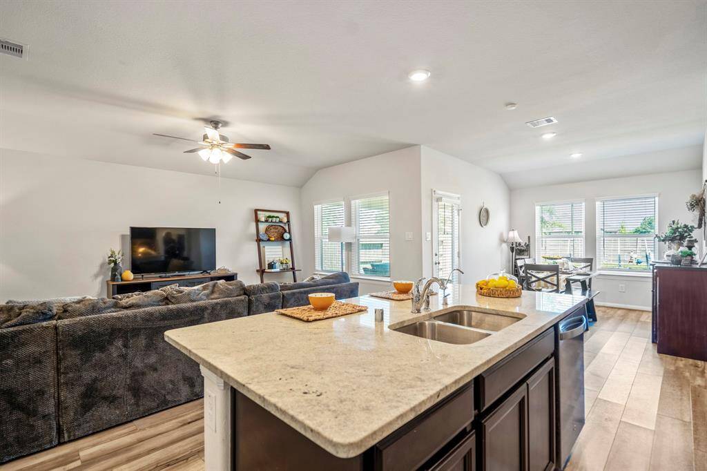Your kitchen has been upgraded with granite counters, stainless steel appliances,a walk-in pantry, and open to the living areas.