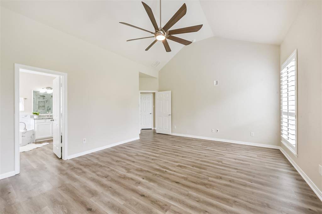 Primary bedroom has high ceilings