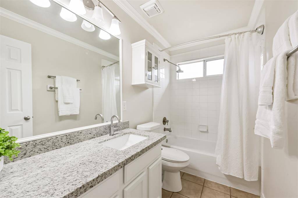 Upstairs hall bath, granite counters and undermount sink.