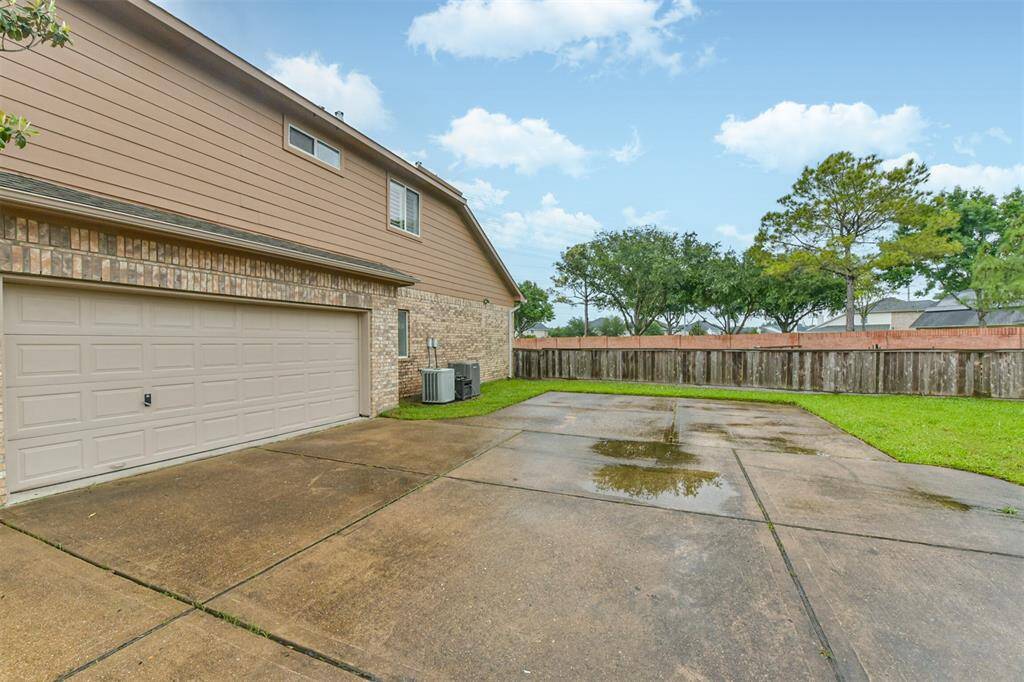Oversized 2 car attached garage with extra parking.